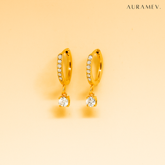 Solitaire Drop Gold Huggie Earrings: 18K gold plated anti-tarnish hoops with dangling clear crystal stone, perfect for everyday wear and minimal styling.
