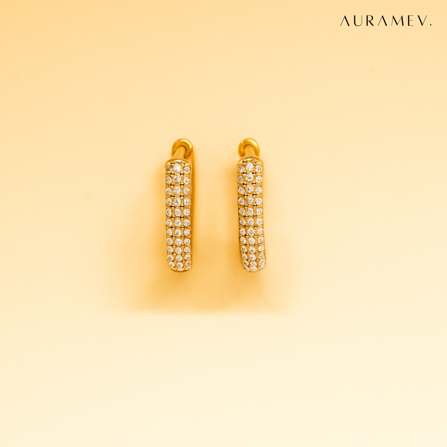 Small gold huggie hoop earrings with zirconia crystal accents, 18K PVD gold plated finish